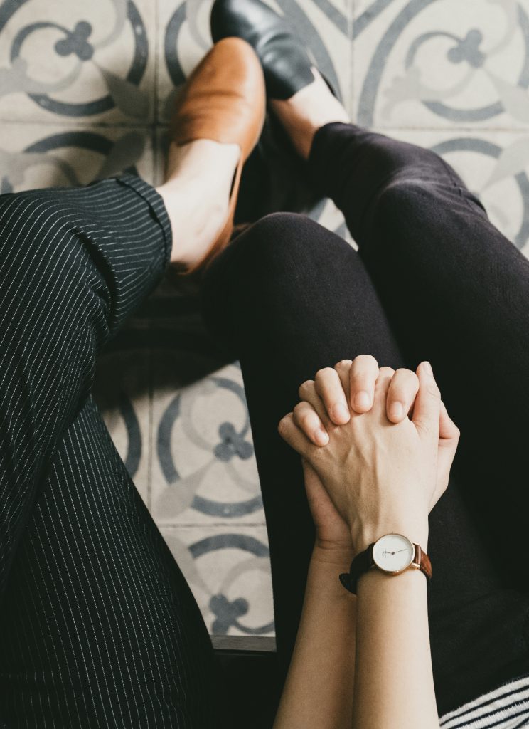 Female couple holding hands